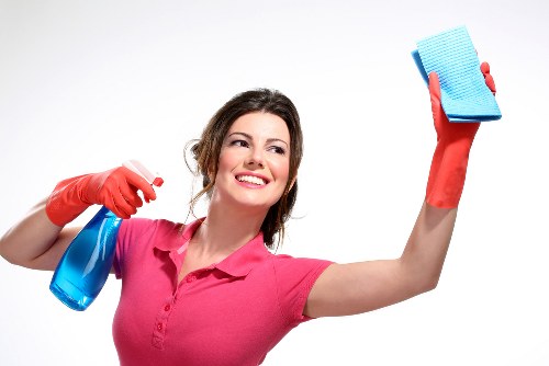 Worker using PPE during a task in a controlled environment